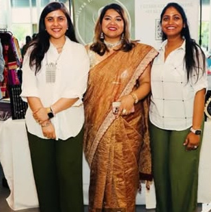 Three women together at an indoor event